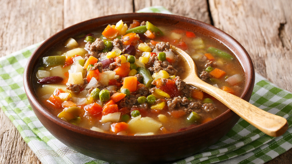 Hamburger stew in a brown bowl