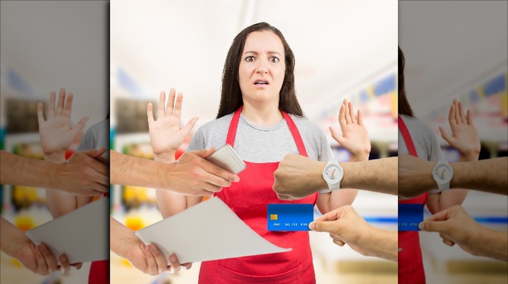 overworked saleswoman at grocery store