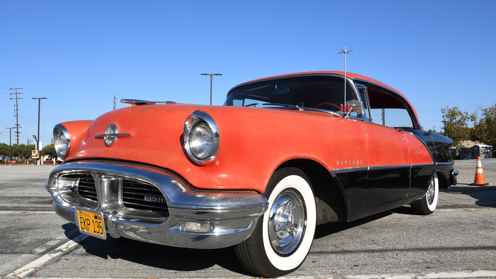 a red and black Oldsmobile 88 model