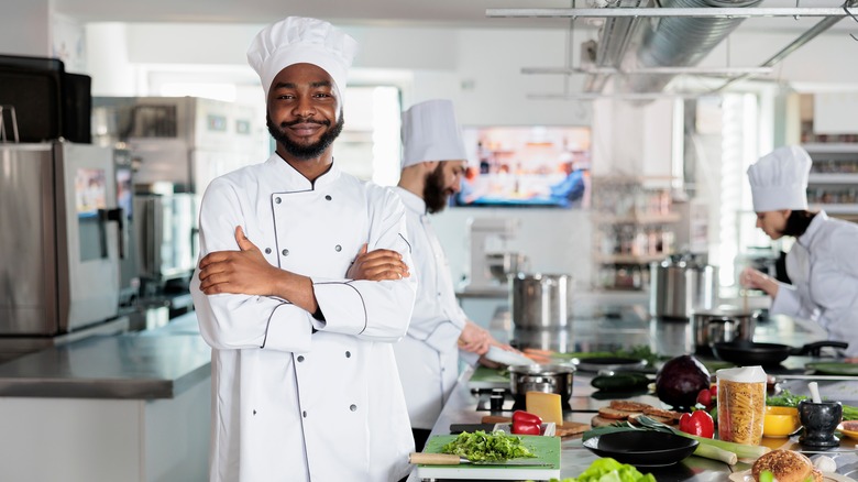 Chef poses in restaurant