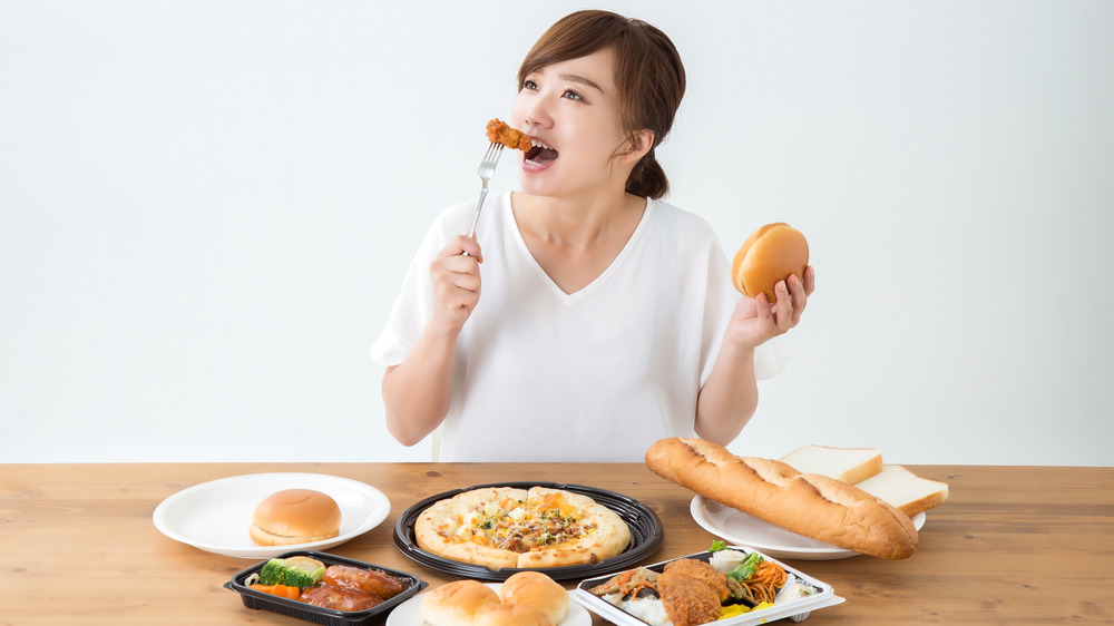 Woman eating junk food