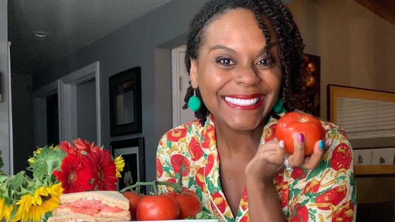 tabitha brown holding tomato