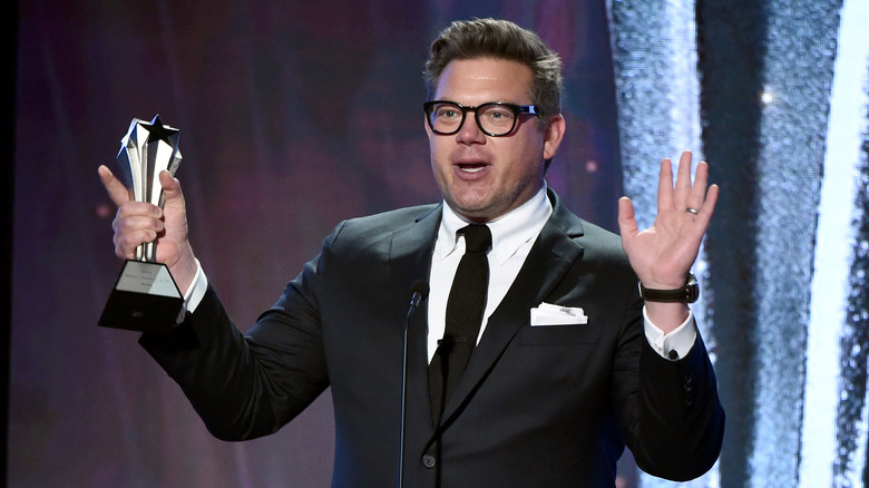 Tyler Florence holding an award