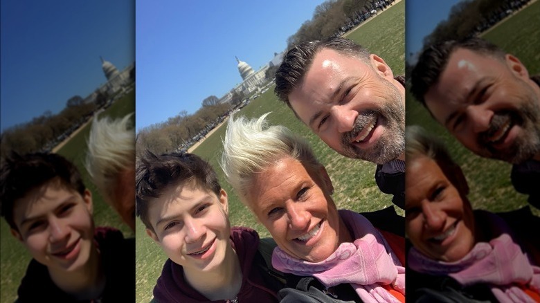 Anne Burrell, Stuart Claxton, and Stuart's son smiling