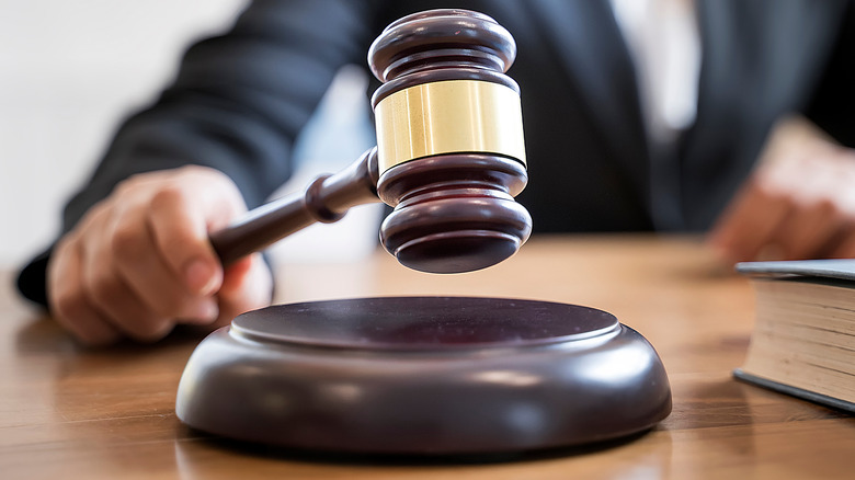 Woman banging on a judge's gavel