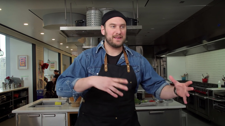 brad leone in apron waving hands