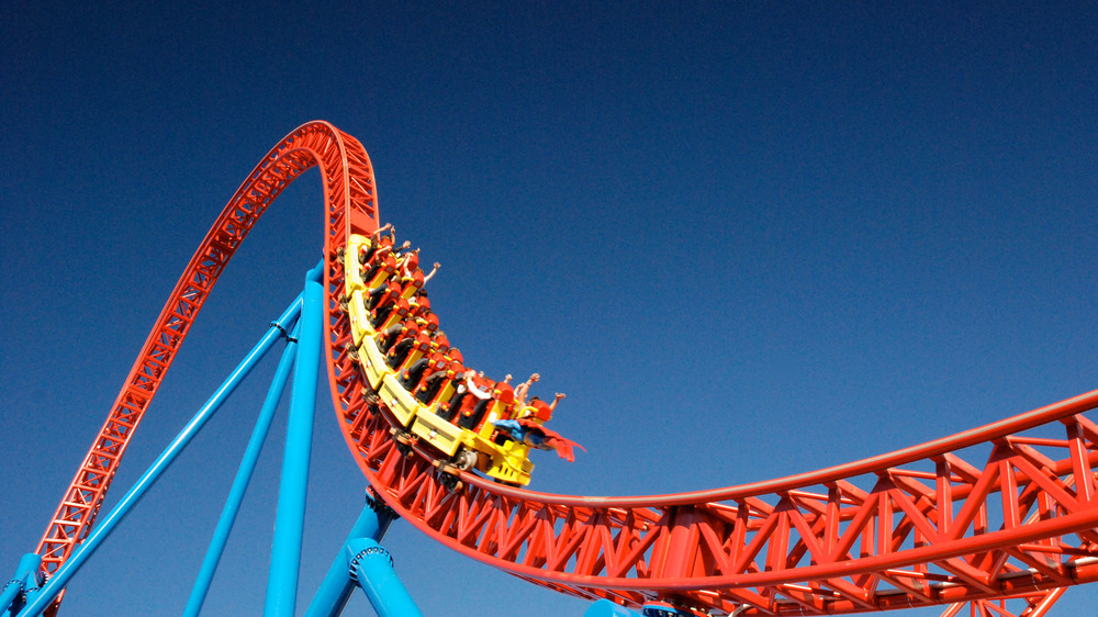 People on a red roller coaster