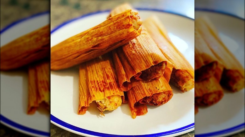 Delicious tamales on plate