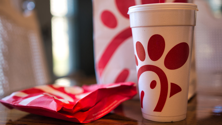 White styrofoam cup and red packaging with Chick-fil-A logo