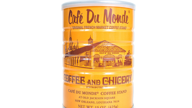 yellow cafe du monde chicory coffee tin