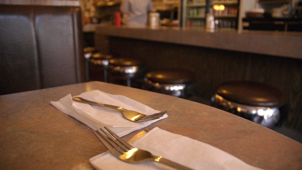 forks and napkins on a diner table