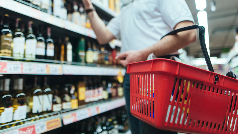 purchasing alcohol with red basket