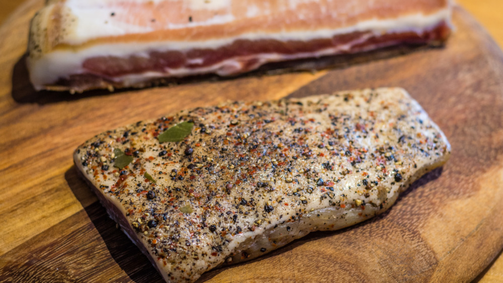 dry aged beef with seasoning on a board