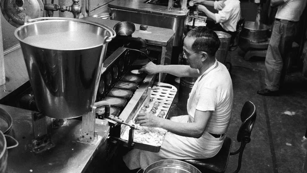 man making fortune cookies