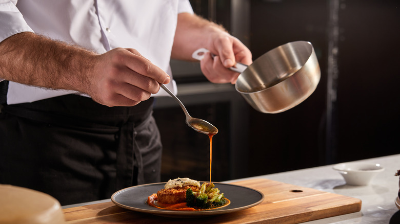 Chef plating food