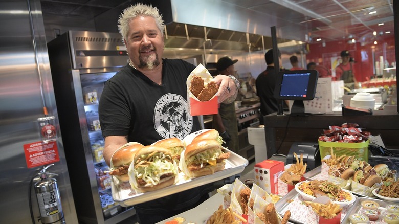 Guy Fieri serves food at Chicken Guy