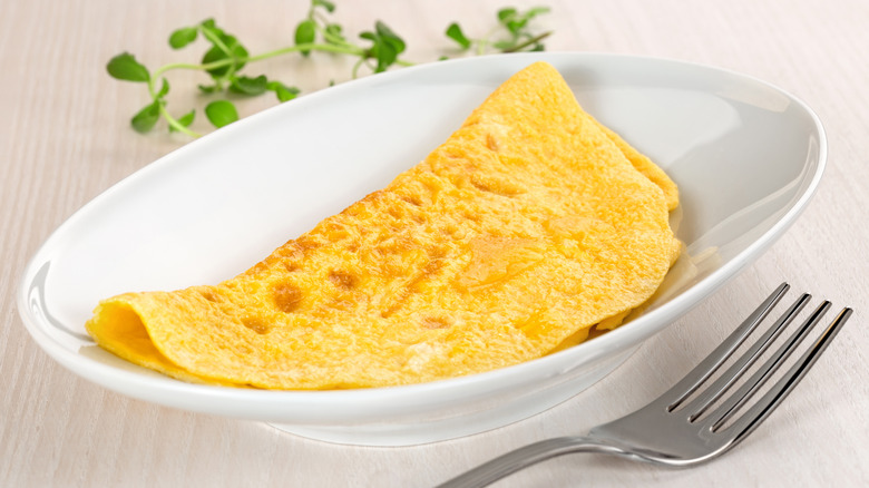 omelet on plate with fork