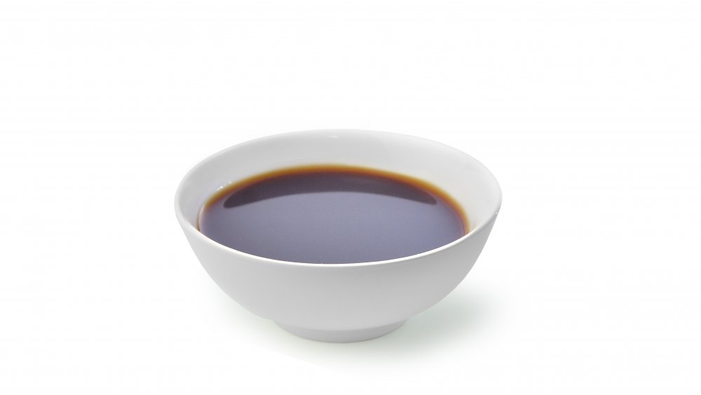 soy sauce in a white bowl 