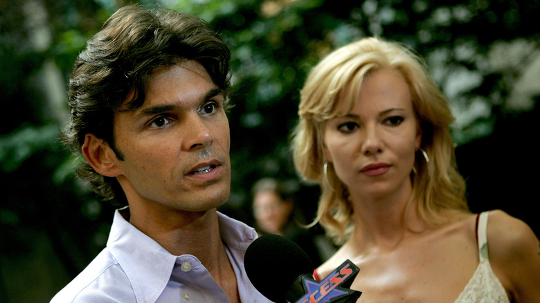 matthew kenney and sarma melngailis standing outside with serious expressions