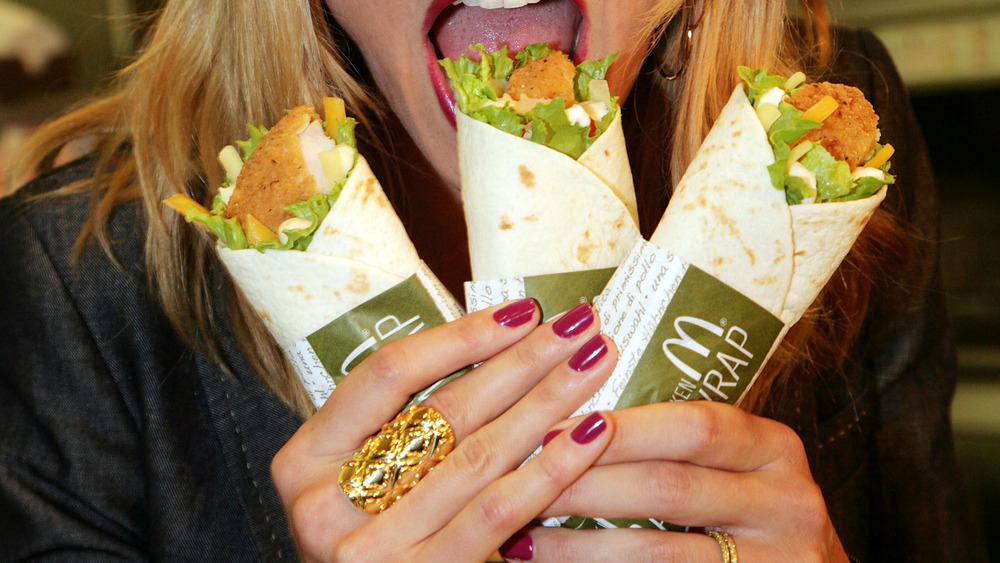 variety of mcdonalds snack wraps being eaten