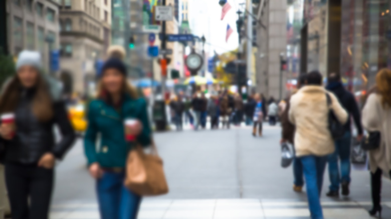 People walking NYC sidewalk