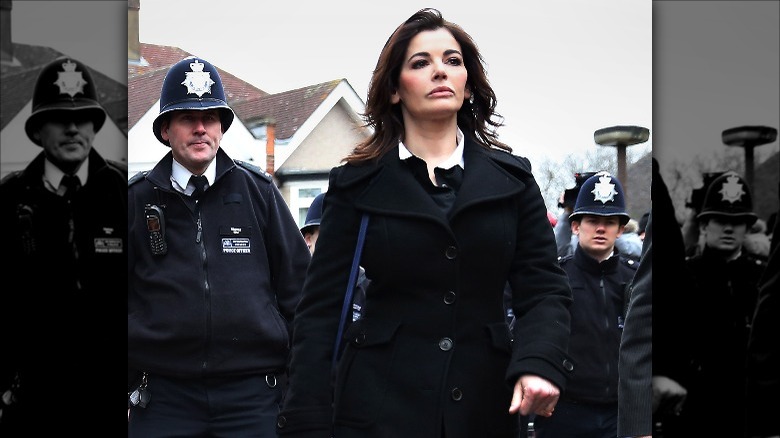 Nigella Lawson with police officers