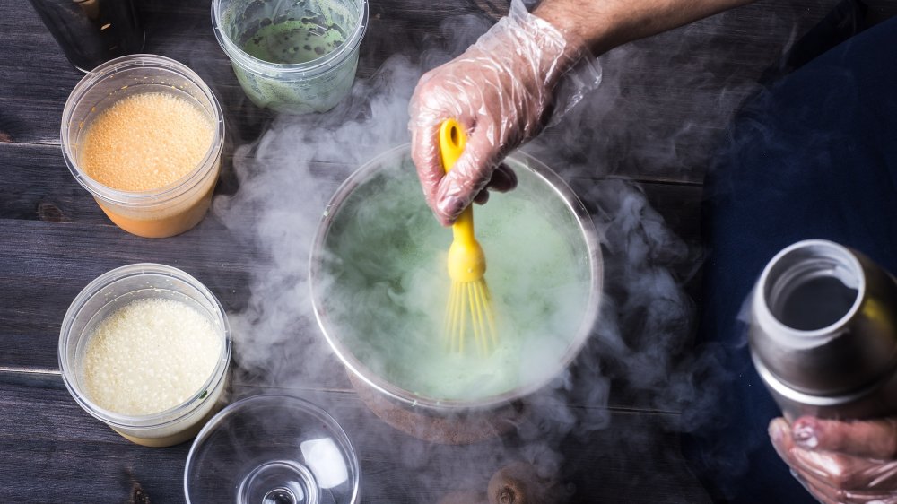 person making liquid nitrogen ice cream