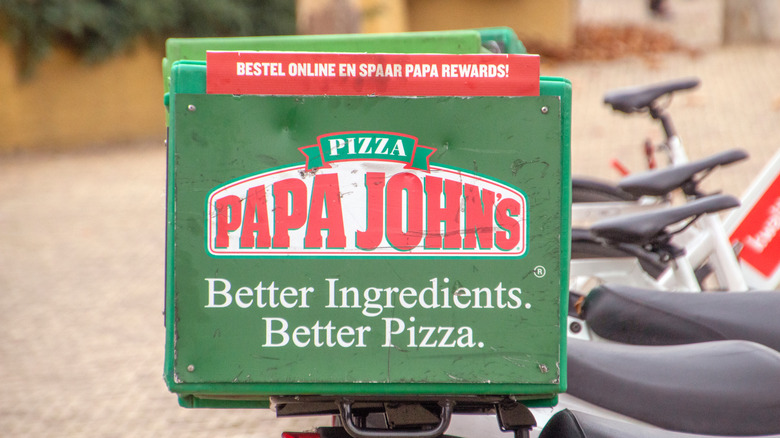 Papa John's pizza box on a bike