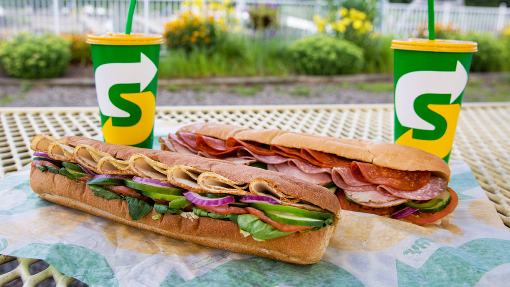 Subway sandwiches on picnic table