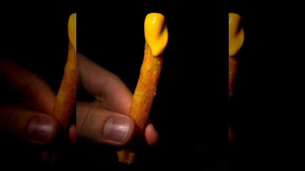 Holding Taco Bell Nacho Fries 