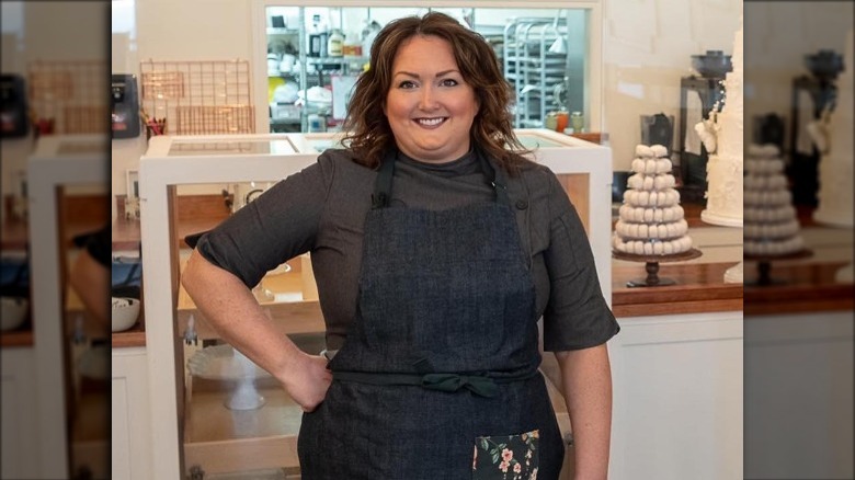 Jen Barney wears an apron at her bakery