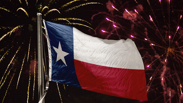 texas flag with fireworks