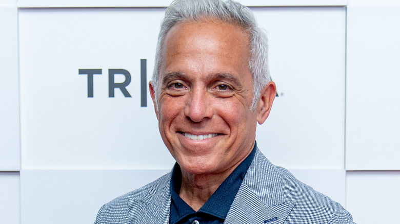 Geoffrey Zakarian smiling in blue suit