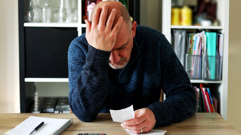 Man stressed by received bill