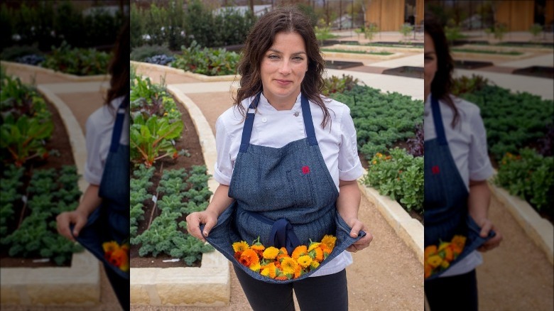 Tim McDiarmid holding flowers in apron