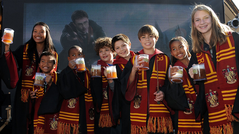 kids hold butterbeer