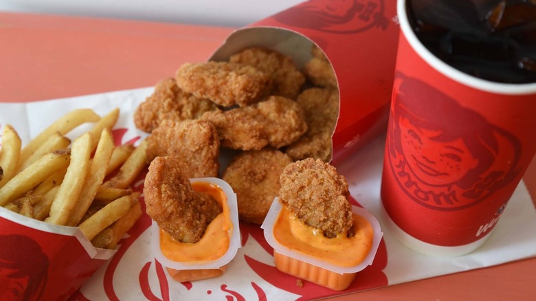 Wendy's chicken nuggets dipped in sauce