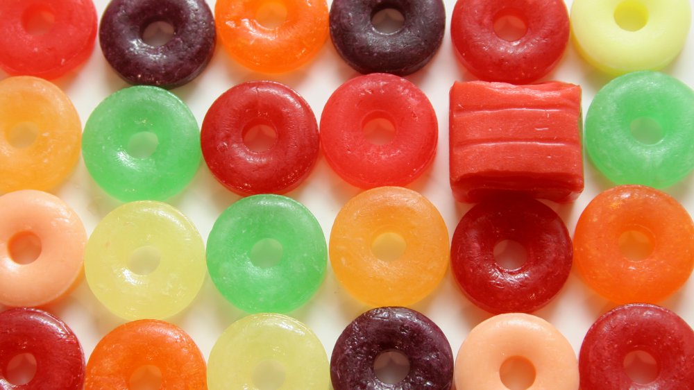 rows of Life Savers with one square candy