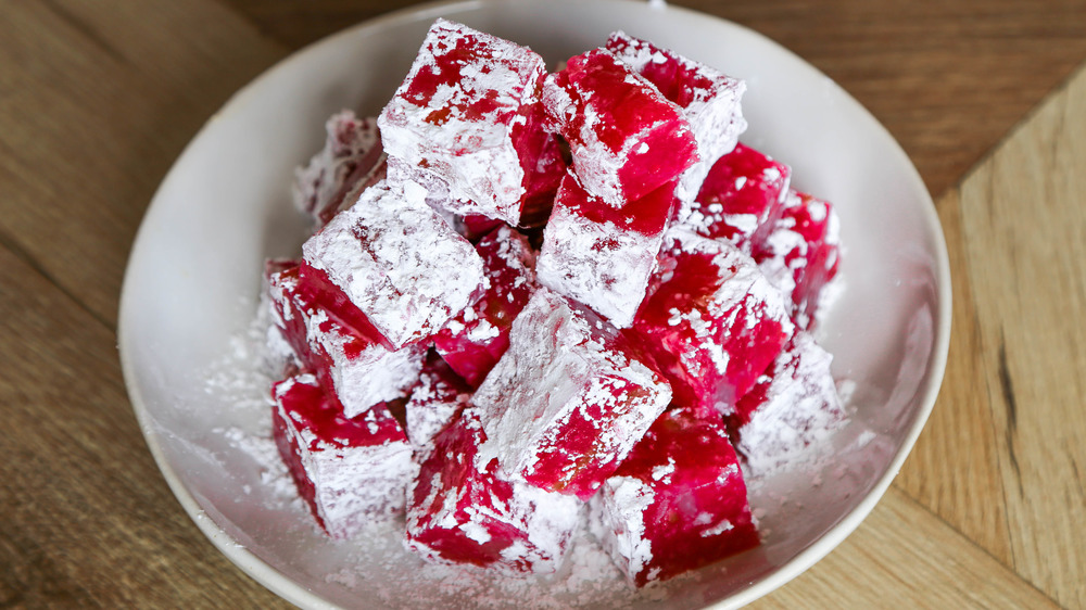 Turkish delight on a white plate in powdered sugar