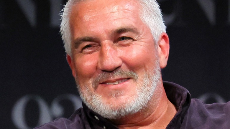 Paul Hollywood grinning in close-up