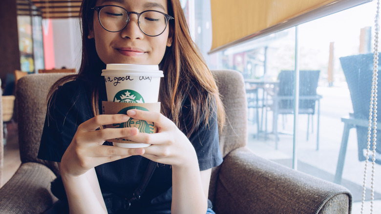 woman enjoying a starbucks coffee