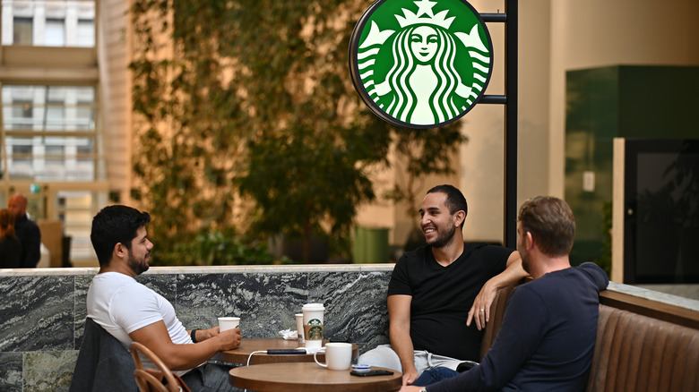 three men meeting at starbucks