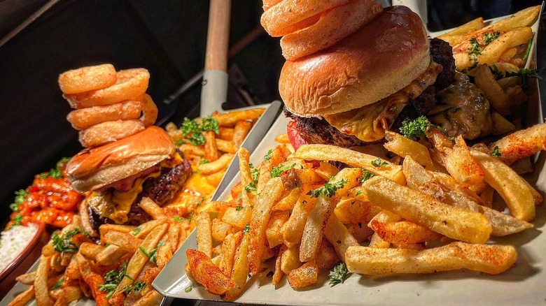 Burgers and fries on shovels