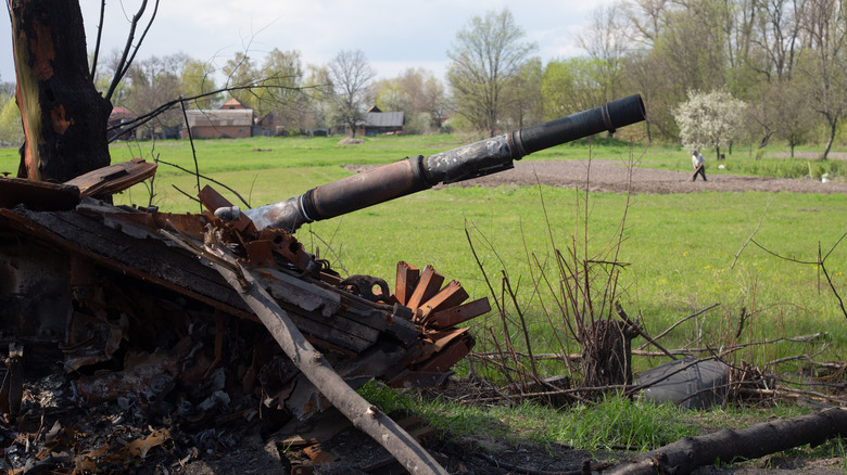 burned out APC with farmer