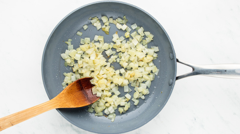 onions and garlic sauteing in pan