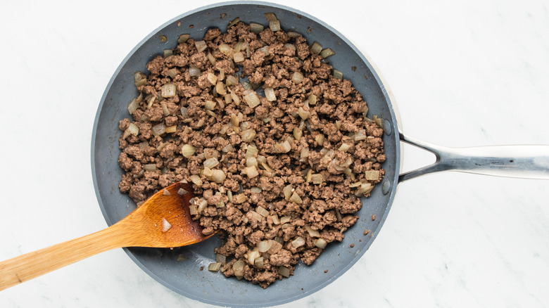 ground beef and onion in skillet