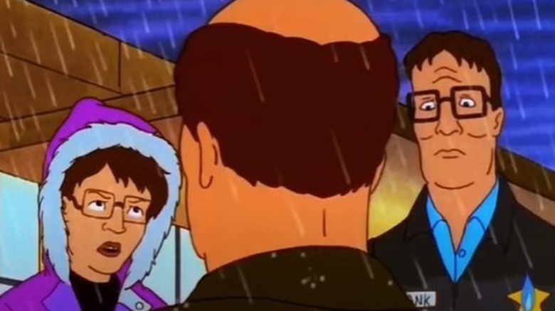 Peggy and Hank Hill in rain