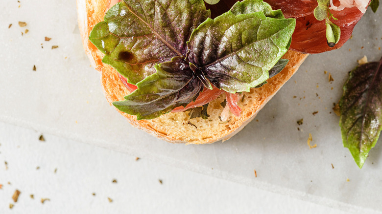 capocollo on bread with basil