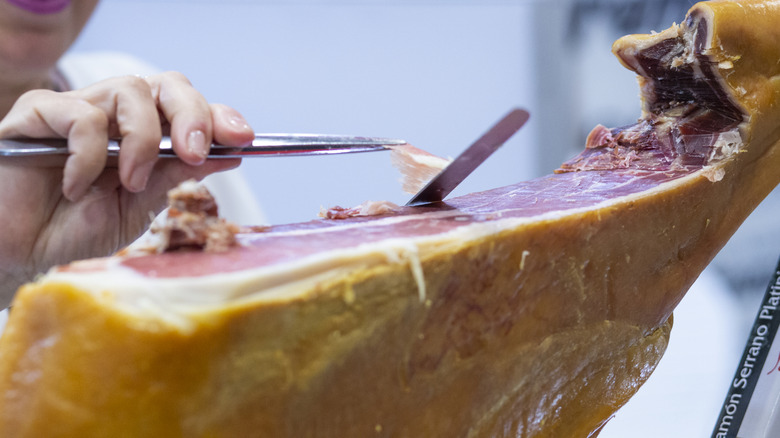 Jamón serrano being cut