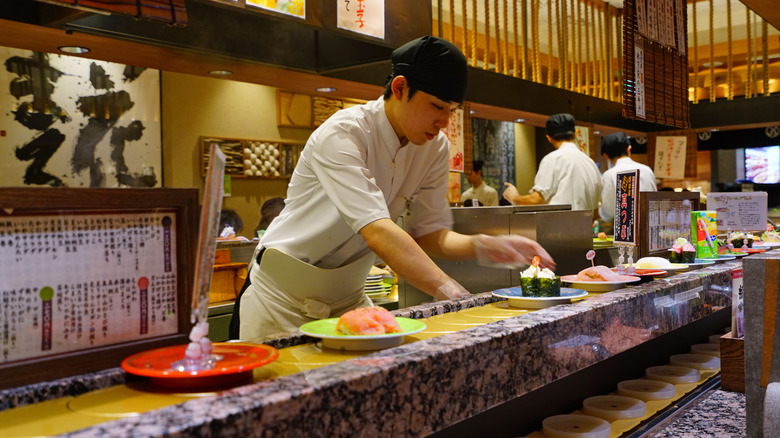 Chefs preparing food at restaurant 